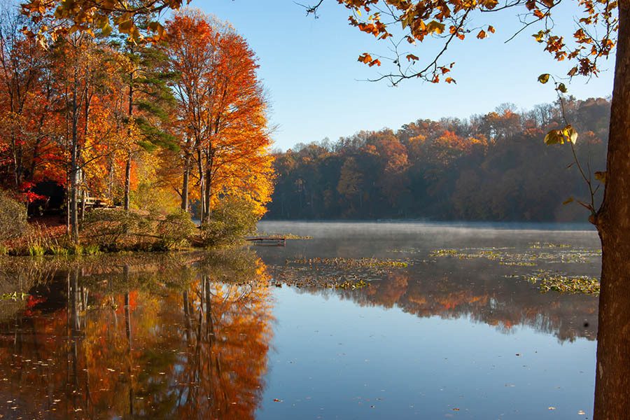 Woodsfeild, OH Insurance - Landscape of a Lake on an Autumn Fall Day with Colorful Leaves and a Clear Blue Sky